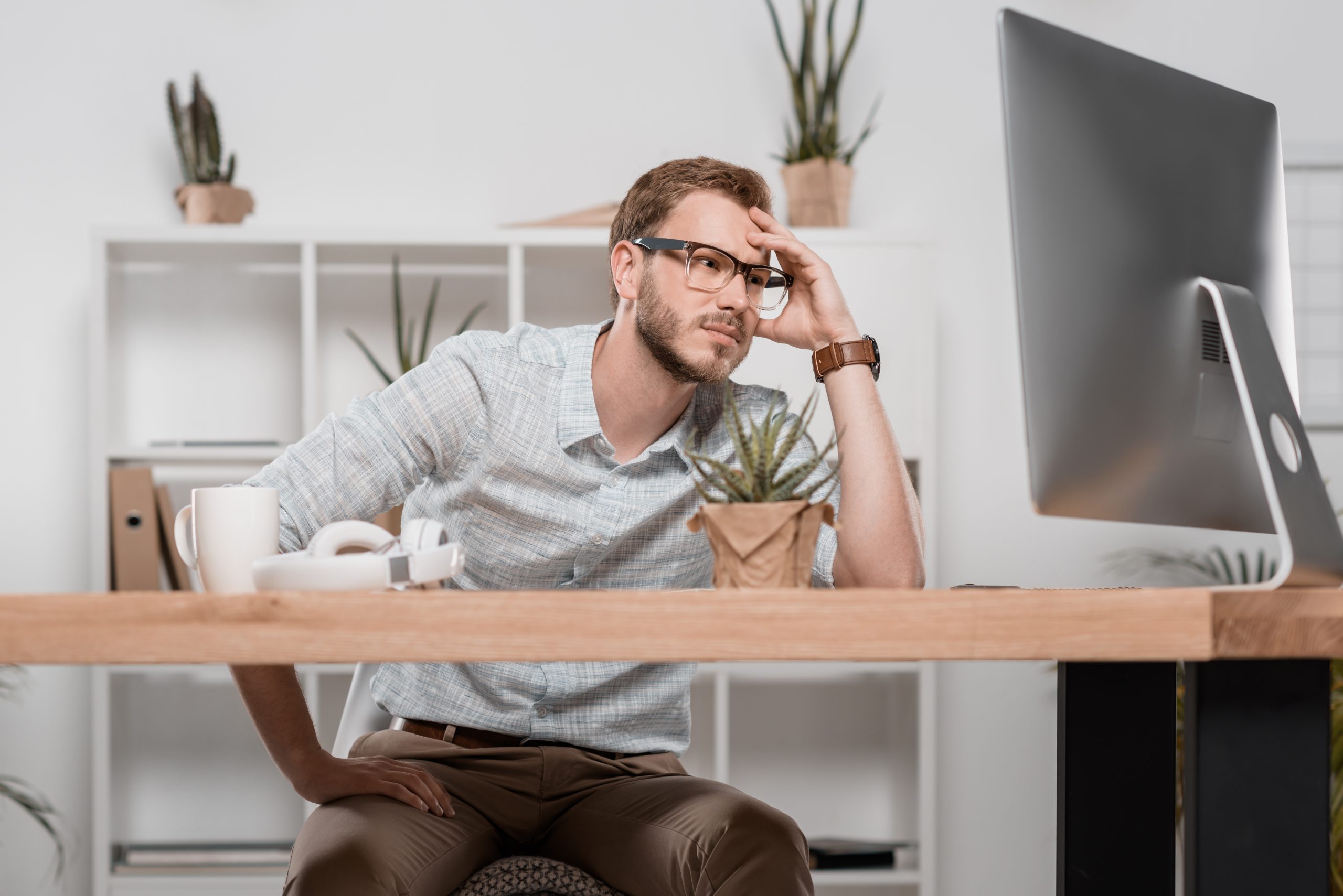 tired caucasian businessman looking at computer mo 2024 11 18 14 29 27 utc scaled
